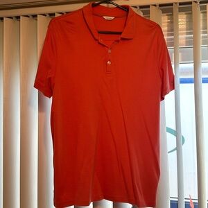 Calvin Klein polo shirt, color dark orange , size medium and good condition!